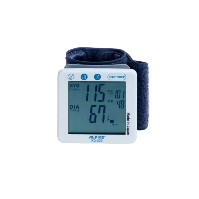 The device has a square digital display screen that shows blood pressure readings, including systolic and diastolic pressure, along with pulse rate. The monitor is designed to be worn on the wrist, with a soft, adjustable cuff for secure and comfortable use. The display features large, clear numbers for easy reading. The ALP-K2-233 is compact and portable, making it convenient for regular blood pressure monitoring at home or on the go. The product emphasizes accuracy, user-friendliness, and durability.
