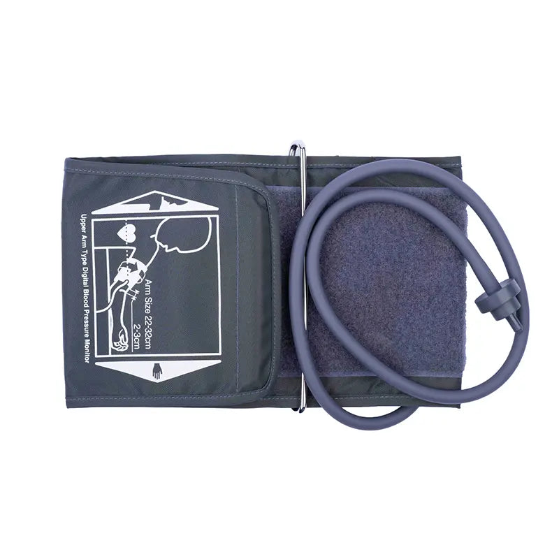 The image shows a medical upper arm blood pressure cuff, neatly folded to display the instructional label. The cuff is dark grey with a diagram and text instructions on how to properly wrap it around the upper arm for accurate measurement. Attached to the cuff is a long, flexible tubing in grey, leading to the pump mechanism, which is not visible in the image. This setup is typical for a manual blood pressure monitor, used either in clinical settings or at home for self-monitoring of blood pressure.