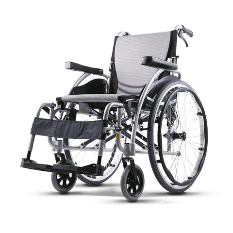 A sleek and modern manual wheelchair with a silver aluminum frame and black accents, featuring large rear wheels for self-propulsion and small front casters for easy maneuverability. The chair is equipped with padded armrests, adjustable footrests, and a breathable mesh backrest for comfort.