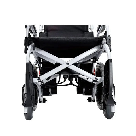 The image shows a direct back view of a foldable motorized wheelchair with a black seat and backrest, highlighting the sturdy X-frame design and wheel locks on the large black rear wheels.