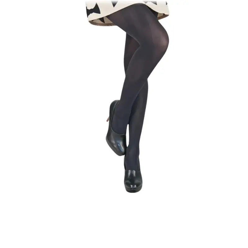 A pair of black, medical-grade compression stockings with a shaping effect, providing light compression of 15-20 mmHg. The stockings are styled with a fashionable look, worn with black heels and a skirt, offering both therapeutic benefits and aesthetic appeal for enhanced leg comfort and support.